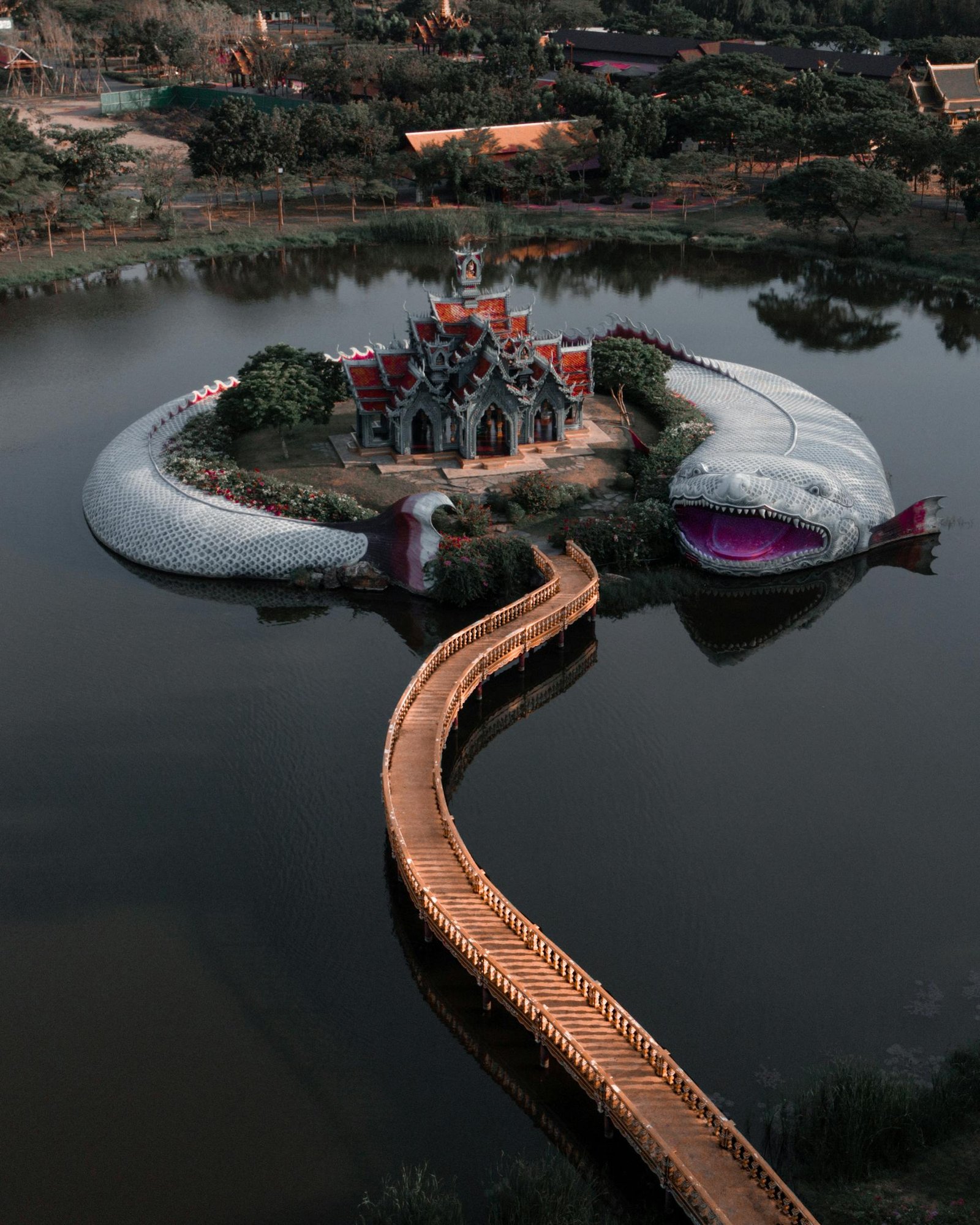 A captivating aerial view of a unique serpent structure encircling an island in Bangkok, Thailand.